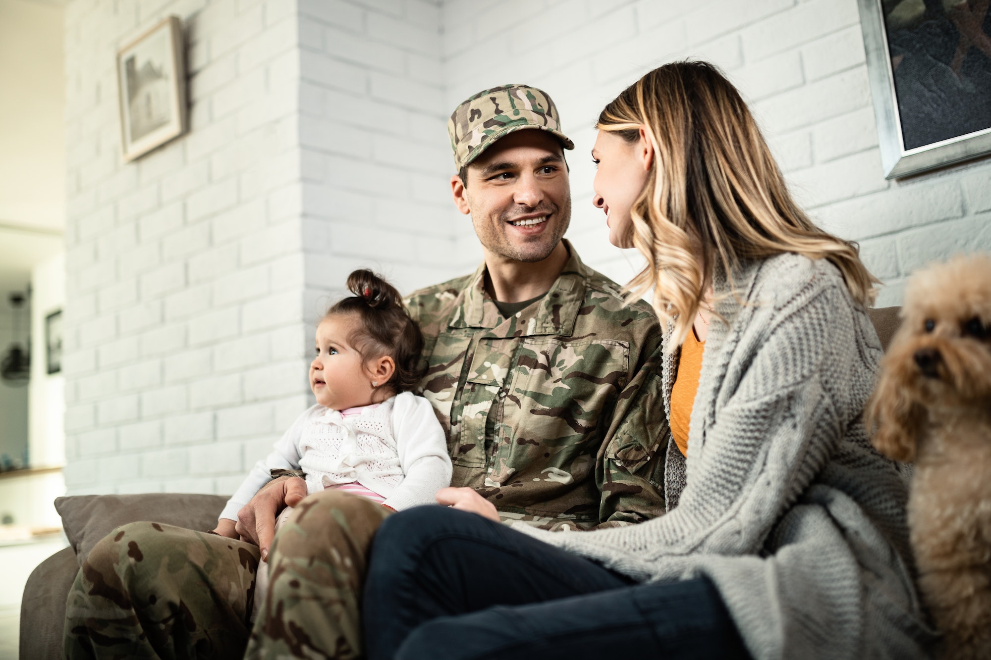 VA Loans recipients and Happy military family reuniting at home.